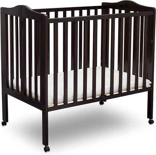 Delta Children Folding Portable Mini Baby Crib with 1.5-inch Mattress, Dark Chocolate