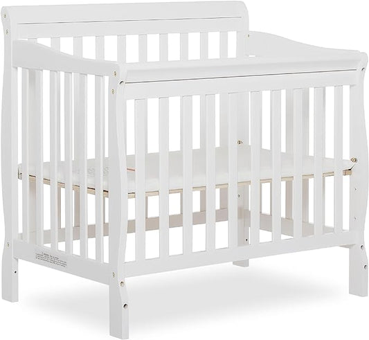 Aden 4-in-1 Convertible Mini Crib In White, Greenguard Gold Certified, Non-Toxic Finish, New Zealand Pinewood, With 3 Mattress Height Settings