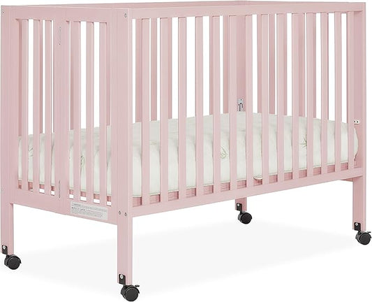Quinn Full-Size Folding Crib in Blush Pink, Removeable Wheels, Modern Nursey, Adjustable Mattress Support, Portable Crib, Patented Folding System